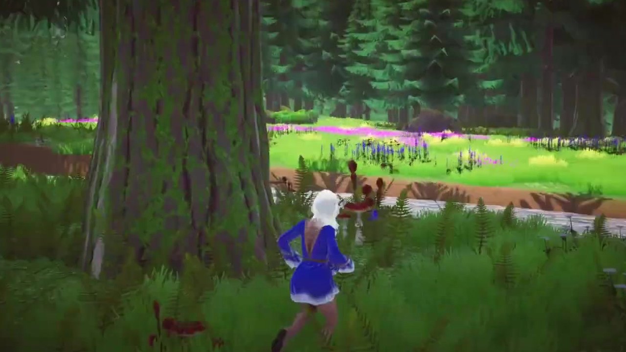 Running past a mossy tree towards a stream and flower meadow